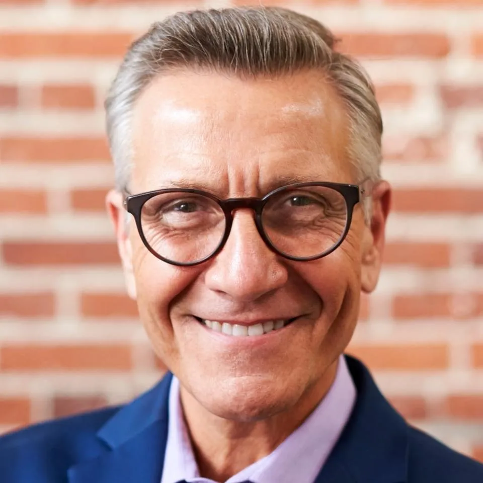 Photo of smiling middle aged man with glasses